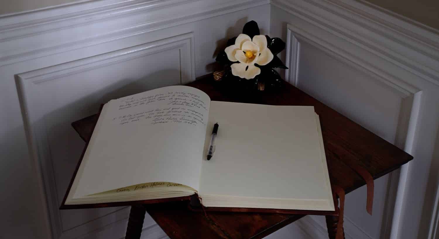 Front entrance foyer corner with small table and guest book