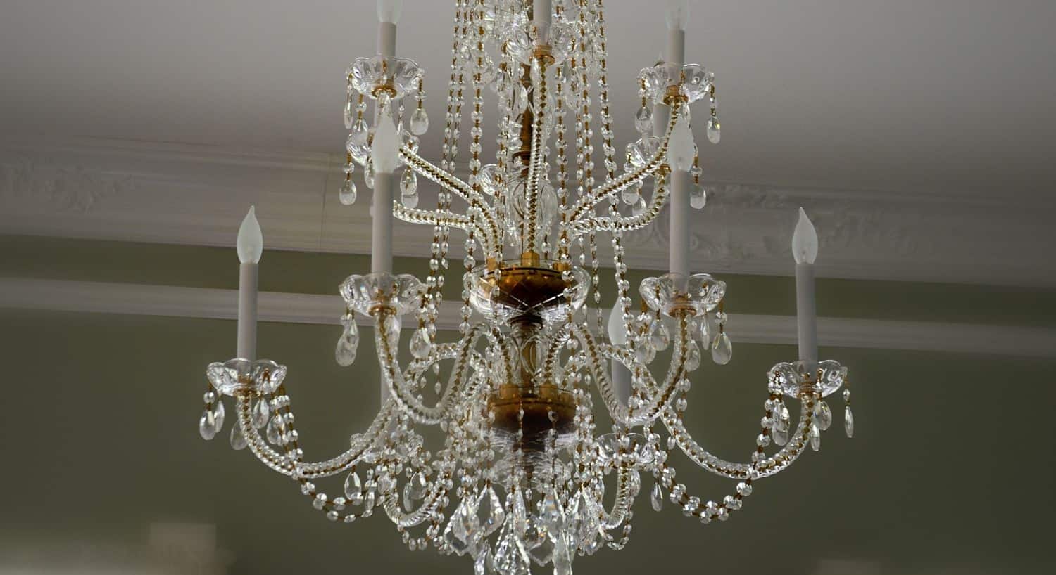 Elegant brass and crystal chandelier with candelabra bulbs