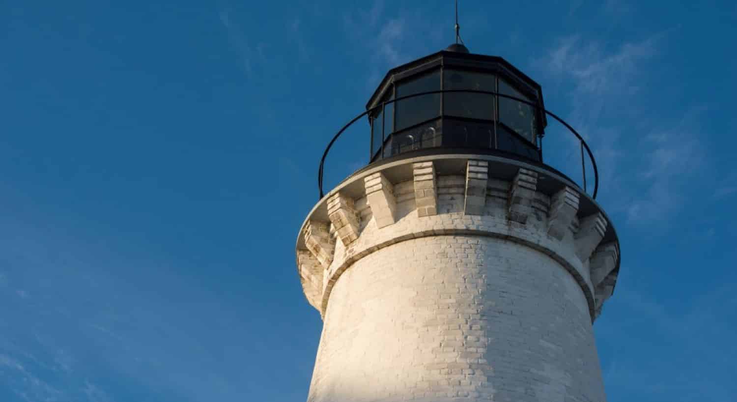 View of the lantern gallery at the top of the lighthouse amidst blue skies