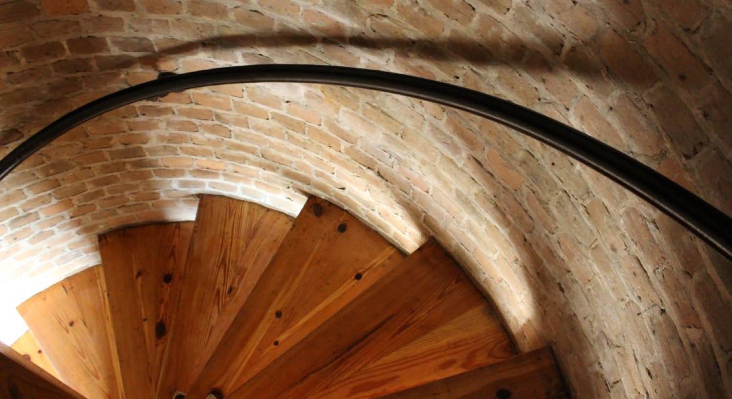 Inside the spiral staircase of the lighthouse that leads to the lantern gallery at the top