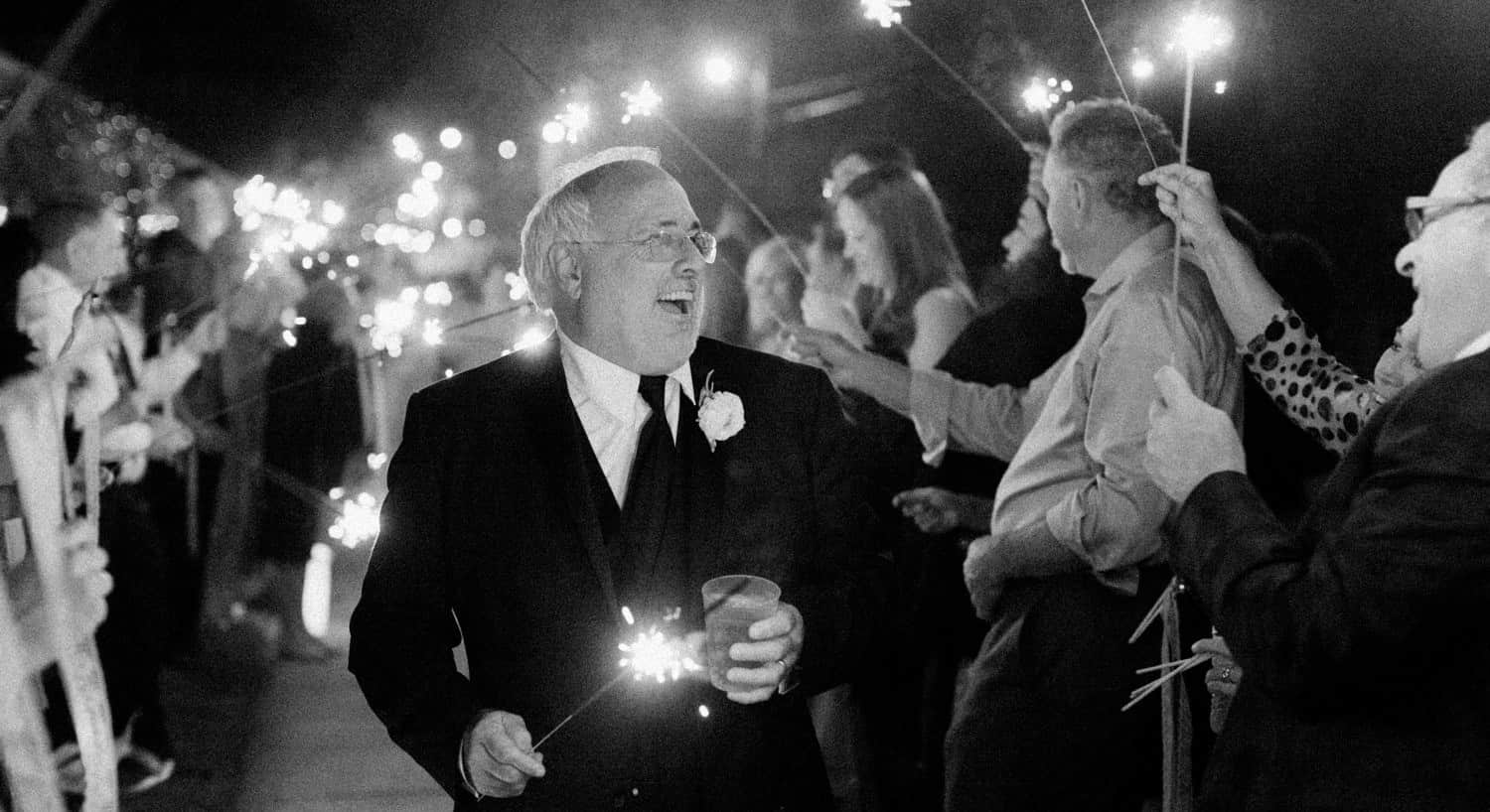 Wedding guests holding sparklers